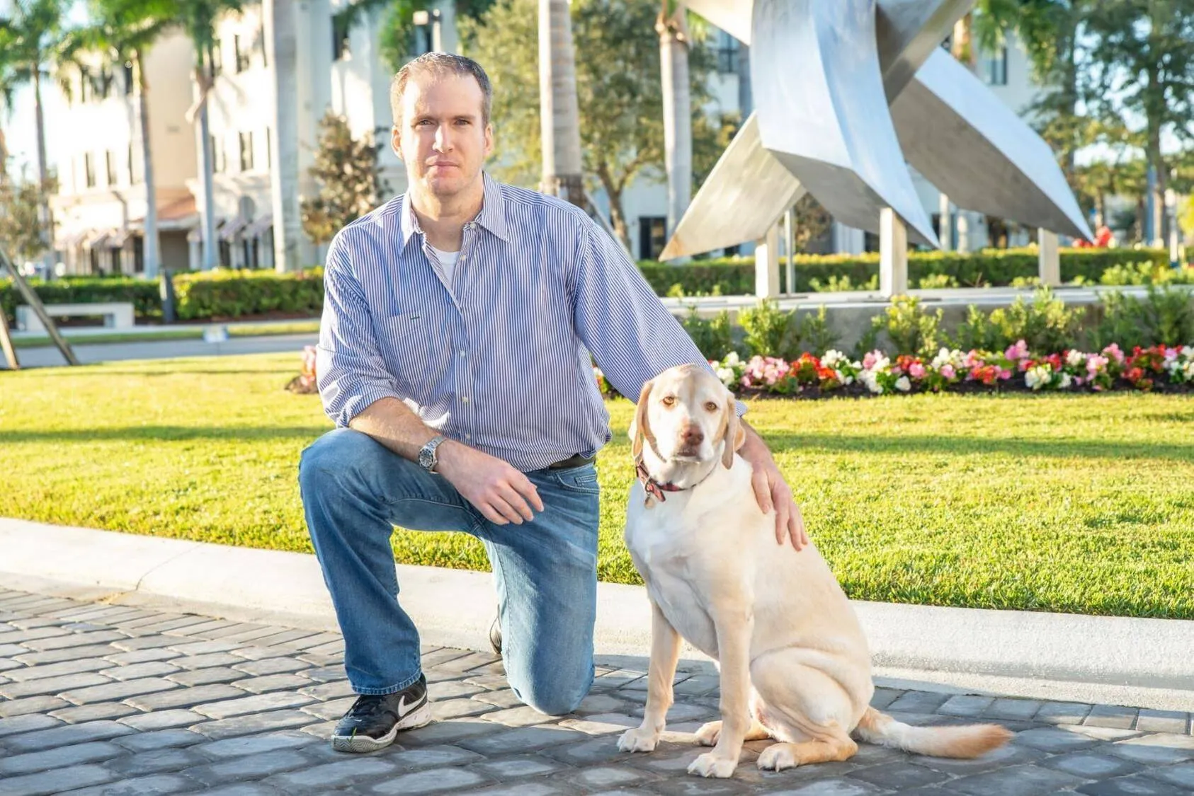 Naples business attorney Chris Wegner and his dog Caliegh outside of the law firm's orginal Naples offices.